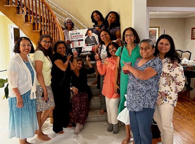 Vaughan residents rally for Deven — home gathering with campaign poster