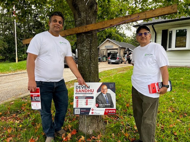 Two Vaughan residents with Deven Sandhu lawn sign — canvassing day